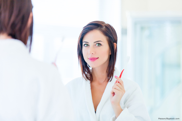 woman with toothbrush